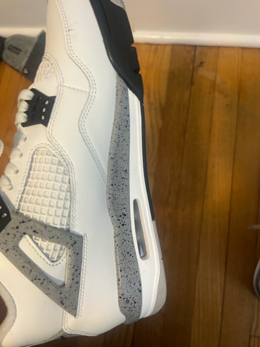 Jordan Men’s White and Black Speckled Sneakers